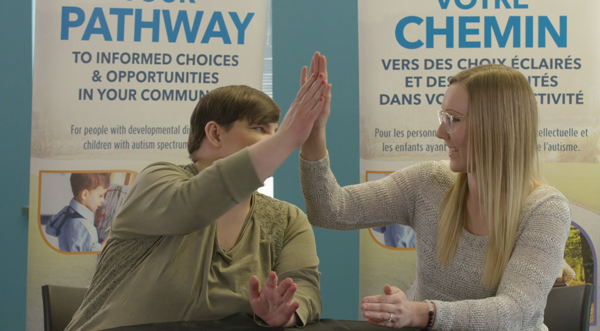 A client with an employee of SCS